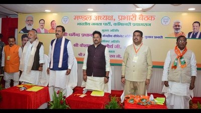 BJP UP’s election in-charge Dharmendra Pradhan with others during the party meeting in Prayagraj.