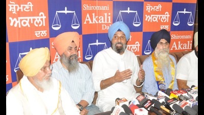 Shiromani Akali Dal MLA Bikram Singh Majithia with party leaders addressing a press conference in Amritsar.