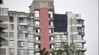 The fire at 15-storey Hansa Heritage in Kandivli broke out around 8.30pm. It was doused after more than three hours. Two people from the 14th floor flat had died in the incident. (HT FILE)