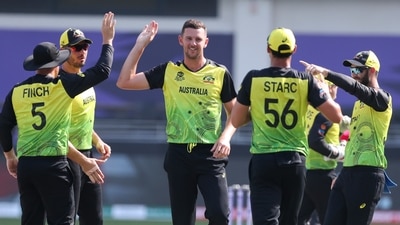Australia's Josh Hazlewood, centre, celebrates with teammates after the dismissal of Bangladesh's Soumya Sarkar during the Cricket Twenty20 World Cup match between Australia and Bangladesh in Dubai, UAE, Thursday, Nov. 4, 2021. (AP) Australia's Josh Hazlewood, centre, celebrates with teammates after the dismissal of Bangladesh's Soumya Sarkar during the Cricket Twenty20 World Cup match between Australia and Bangladesh in Dubai, UAE, Thursday, Nov. 4, 2021. (AP)