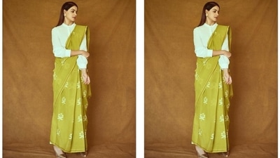 Genelia opted for gold patterned pointed sandals, statement puzzle-shaped bronze earrings, and a swirled silver ring to accessorise the drape. She left her long locks open in a side parting and styled them in a sleek pulled-back look. (Instagram/@who_wore_what_when) Genelia opted for gold patterned pointed sandals, statement puzzle-shaped bronze earrings, and a swirled silver ring to accessorise the drape. She left her long locks open in a side parting and styled them in a sleek pulled-back look. (Instagram/@who_wore_what_when)