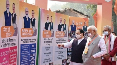 Bharatiya Janata Party (BJP) president JP Nadda shows the achievements of the party to Prime Minister Narendra Modi during the BJP national executive meeting, in New Delhi on Sunday. (ANI Photo) Bharatiya Janata Party (BJP) president JP Nadda shows the achievements of the party to Prime Minister Narendra Modi during the BJP national executive meeting, in New Delhi on Sunday. (ANI Photo)