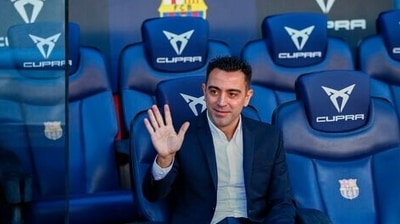 FC Barcelona's new coach Xavi Hernandez waves during his official presentation at the Camp Nou stadium in Barcelona, Spain, Monday, Nov. 8, 2021. (AP) FC Barcelona's new coach Xavi Hernandez waves during his official presentation at the Camp Nou stadium in Barcelona, Spain, Monday, Nov. 8, 2021. (AP)