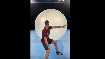 The image shows a man aiming at the balloons. (Instagram/@howridiculous) The image shows a man aiming at the balloons. (Instagram/@howridiculous)