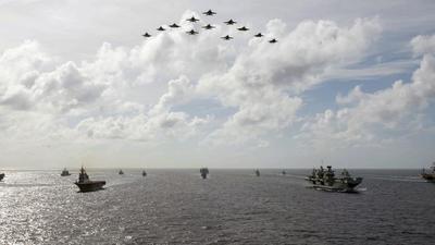 A photo released by the US Indo-Pacific Command shows the UK’s carrier strike group, Japan’s Maritime Self-Defence Forces, and the US Navy’s carrier strike groups conducting joint drills in the Philippine Sea on on October 3, 2021. (AP/File) A photo released by the US Indo-Pacific Command shows the UK’s carrier strike group, Japan’s Maritime Self-Defence Forces, and the US Navy’s carrier strike groups conducting joint drills in the Philippine Sea on on October 3, 2021. (AP/File)