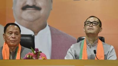 Manipur MLAs Yamthong Haokip (L) and Rajkumar Imo Singh join BJP at BJP HQ in New Delhi, Monday (PTI) Manipur MLAs Yamthong Haokip (L) and Rajkumar Imo Singh join BJP at BJP HQ in New Delhi, Monday (PTI)