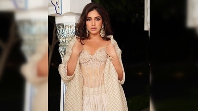 Adding the cherry to the top, Bhumi Pednekar completed her look with a long beige cape that had sequins work on the sleeves. (Instagram/@bhumipednekar) Adding the cherry to the top, Bhumi Pednekar completed her look with a long beige cape that had sequins work on the sleeves. (Instagram/@bhumipednekar)