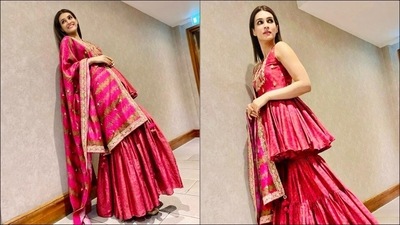 Kriti Sanon stuns in cherry red gharara choli for Diwali celebrations in London (Instagram/punitbalanaofficial) Kriti Sanon stuns in cherry red gharara choli for Diwali celebrations in London (Instagram/punitbalanaofficial)