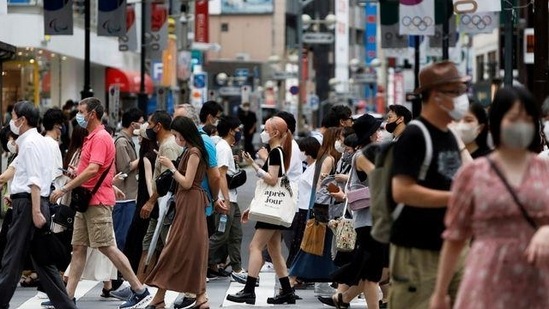People walk at a crossing in Shibuya shopping area, amid the coronavirus disease (Covid-19) pandemic, in Tokyo(Reuters photo)