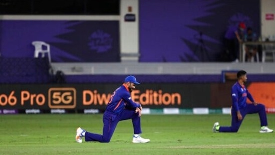 India's captain Virat Kohli takes the knee during the Cricket Twenty20 World Cup match between India and Namibia in Dubai, UAE, Monday, Nov. 8, 2021. (AP Photo/Aijaz Rahi)(AP)