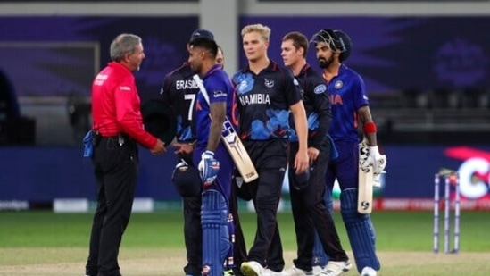India's Suryakumar Yadav speaks with an umpire at the end of the Cricket Twenty20 World Cup match between India and Namibia in Dubai, UAE, Monday, Nov. 8, 2021. (AP Photo/Aijaz Rahi)(AP)