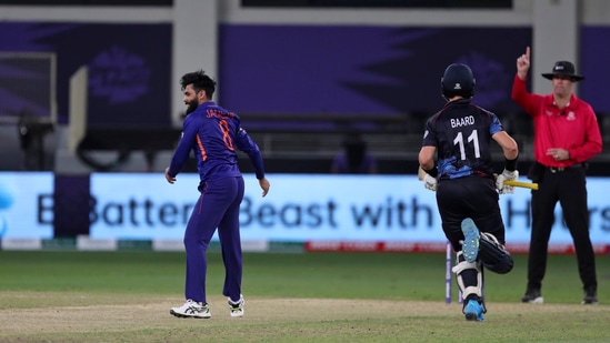 The umpire signals out as India's Ravindra Jadeja, left, celebrates the dismissal of Namibia's Stephan Baard during the Cricket Twenty20 World Cup match between India and Namibia in Dubai, UAE, Monday, Nov. 8, 2021. (AP Photo/Aijaz Rahi)(AP)