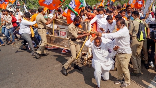 Police stops a BJP youth activists during a protest against the visit of Odisha CM Naveen Pattnaik to Kalahandi to enquire into the alleged case of murder of Mamita Meher. (PTI)