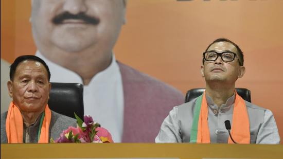 Manipur MLAs Yamthong Haokip (L) and Rajkumar Imo Singh join BJP at BJP HQ in New Delhi, Monday (PTI)