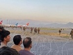 Afghan crowd at the Kabul airport as US soldiers stand guard on August 16. (AFP) Afghan crowd at the Kabul airport as US soldiers stand guard on August 16. (AFP)