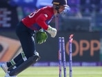 England's Jos Buttler runs out Bangladesh's Afif Hossain during the Cricket Twenty20 World Cup match between England and Bangladesh in Abu Dhabi, UAE, Wednesday, Oct. 27, 2021.(AP) England's Jos Buttler runs out Bangladesh's Afif Hossain during the Cricket Twenty20 World Cup match between England and Bangladesh in Abu Dhabi, UAE, Wednesday, Oct. 27, 2021.(AP)