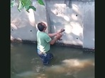 This man gets into a canal to save a drowning stray puppy. (Jukin Media) This man gets into a canal to save a drowning stray puppy. (Jukin Media)