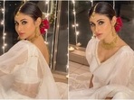This festive season has made way for the classic white hue in our ethnic wardrobe, ditching the usual roster of bright colours and jewel tones. It means white is going to be the favourite look of the wedding season too. Bollywood's most stylish celebrities have also given the trend a stamp of approval by wearing the classic colour for many events. And Mouni Roy seems to be the latest trend-setter in this list.(Instagram/@imouniroy) This festive season has made way for the classic white hue in our ethnic wardrobe, ditching the usual roster of bright colours and jewel tones. It means white is going to be the favourite look of the wedding season too. Bollywood's most stylish celebrities have also given the trend a stamp of approval by wearing the classic colour for many events. And Mouni Roy seems to be the latest trend-setter in this list.(Instagram/@imouniroy)