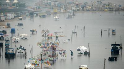 Though there has been a respite from rain on Tuesday, with Chennai registering 11 mm rainfall until 5.30 pm, parts of the city are still inundated from heavy rainfall over the weekend. (AFP) Though there has been a respite from rain on Tuesday, with Chennai registering 11 mm rainfall until 5.30 pm, parts of the city are still inundated from heavy rainfall over the weekend. (AFP)