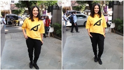 Sunny Leone wore a yellow hoodie which she teamed with black joggers and boots. (HT Photo/Varinder Chawla) Sunny Leone wore a yellow hoodie which she teamed with black joggers and boots. (HT Photo/Varinder Chawla)