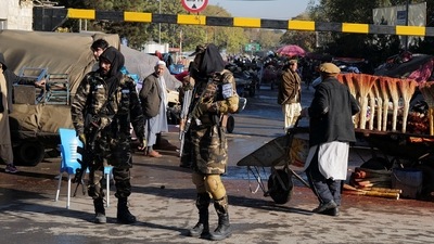 Taliban fighters stand as they hold a checkpoint in Kabul, Afghanistan on November 5, 2021.&nbsp; (Reuters )