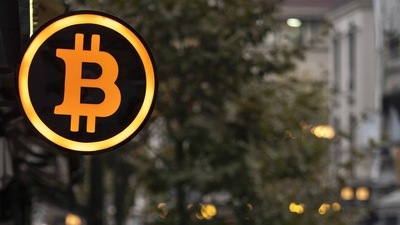 Though both virtual currencies pulled back from their highs in the US session, their trajectory was clearly headed higher. In picture - A bitcoin logo outside a cryptocurrency exchange kiosk in Istanbul, Turkey. (Bloomberg) Though both virtual currencies pulled back from their highs in the US session, their trajectory was clearly headed higher. In picture - A bitcoin logo outside a cryptocurrency exchange kiosk in Istanbul, Turkey. (Bloomberg)