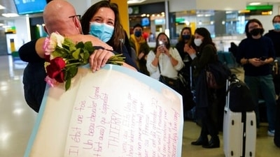 People who have been away from their loved ones for more than a year and a half, finally reunited and exchanged hugs and kisses after the United States finally lifted travel restrictions. In this photo, people applaud and take pictures as a women greets her boyfriend after he arrived from France at Newark Liberty International Airport in Newark. (AP) People who have been away from their loved ones for more than a year and a half, finally reunited and exchanged hugs and kisses after the United States finally lifted travel restrictions. In this photo, people applaud and take pictures as a women greets her boyfriend after he arrived from France at Newark Liberty International Airport in Newark. (AP)
