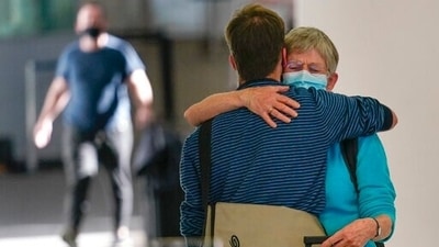 A women greets her son, Joost Wagenaar, after she flew from the Netherlands at Newark Liberty International Airport in Newark, New Jersey, 2021. (AP) A women greets her son, Joost Wagenaar, after she flew from the Netherlands at Newark Liberty International Airport in Newark, New Jersey, 2021. (AP)