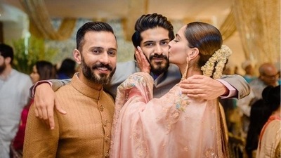 Sonam Kapoor and Anand Ahuja with Harsh Varrdhan Kapoor at her wedding. Sonam Kapoor and Anand Ahuja with Harsh Varrdhan Kapoor at her wedding.