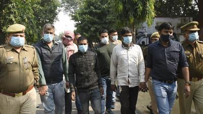 The suspects of the double murder case in police custody, in Ghaziabad on Tuesday. (Sakib Ali/HT) The suspects of the double murder case in police custody, in Ghaziabad on Tuesday. (Sakib Ali/HT)