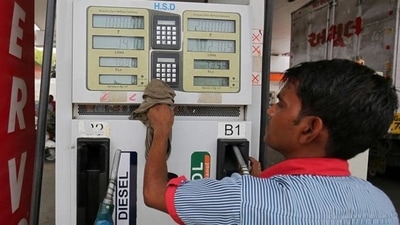 A man cleans a pump at a fuel station in Ahmedabad, India. Ten non-BJP states are yet to cut VAT on petrol and diesel. (REUTERS/File) A man cleans a pump at a fuel station in Ahmedabad, India. Ten non-BJP states are yet to cut VAT on petrol and diesel. (REUTERS/File)
