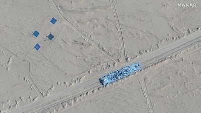 This handout satellite image released by Maxar Technologies shows a mobile target on a rail track in Ruoqiang county in the Taklamakan Desert, in China's Xinjiang region. (AFP Photo) This handout satellite image released by Maxar Technologies shows a mobile target on a rail track in Ruoqiang county in the Taklamakan Desert, in China's Xinjiang region. (AFP Photo)