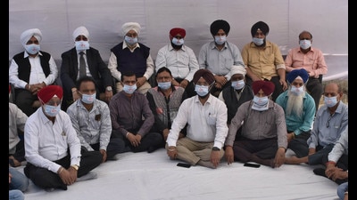 Ludhiana industrialists protesting against the rising prices of raw materials on Tuesday. (Harsimar Pal Singh/HT)
