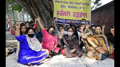 Assistant professors protesting against the Punjab government at Government College for Girls in Ludhiana on Tuesday. (Harsimar Pal Singh/HT)