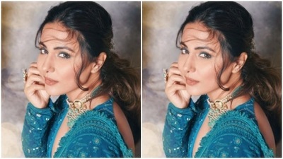 Hina teamed the midriff-baring full-sleeved blouse with a flowy chikankari blue skirt. (Instagram/@realhinakhan)