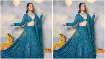 Assisted by makeup artist Sachin Salvi, Hina chose to deck up in blue eyeshadow, mascara-laden eyelashes, contoured face and a shade of nude lipstick. (Instagram/@realhinakhan)