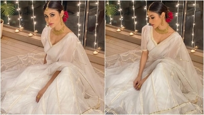 The festive season is going in full swing right now, which means our favourite celebrities have been sharing back-to-back stunning traditional looks. Mouni also shared several photos of herself dressed in a pristine white organza lehenga set for a celebration at home and inspired us to steal a few pages from her style book. (Instagram/@imouniroy) The festive season is going in full swing right now, which means our favourite celebrities have been sharing back-to-back stunning traditional looks. Mouni also shared several photos of herself dressed in a pristine white organza lehenga set for a celebration at home and inspired us to steal a few pages from her style book. (Instagram/@imouniroy)