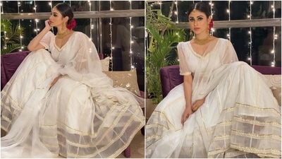 Additionally, the lehenga comes attached with Cancan to give it the royal flare. In the end, Mouni draped an organza white dupatta, carrying golden piping, on her shoulders. (Instagram/@imouniroy) Additionally, the lehenga comes attached with Cancan to give it the royal flare. In the end, Mouni draped an organza white dupatta, carrying golden piping, on her shoulders. (Instagram/@imouniroy)