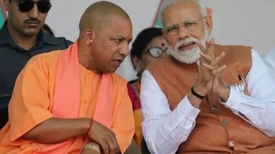 PM Modi with Uttar Pradesh chief minister Yogi Adityanath (File Photo) PM Modi with Uttar Pradesh chief minister Yogi Adityanath (File Photo)