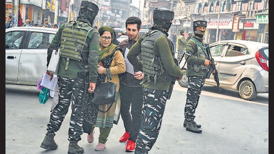 Paramilitary troopers stand guard during a random search along a street in Srinagar on Tuesday. (AFP)