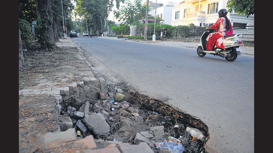 A damaged road in Sector 8, which falls in ward 2 of Chandigarh on Monday. (Keshav Singh/HT)