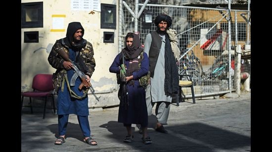 Taliban fighters stand guard at an entrance gate of the Sardar Mohammad Dawood Khan military hospital, Kabul, November 3, 2021 (AFP)