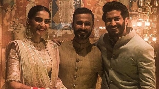 Harsh Varrdhan Kapoor, Sonam Kapoor and Anand Ahuja are all smiles while posing for the camera.(Instagram)