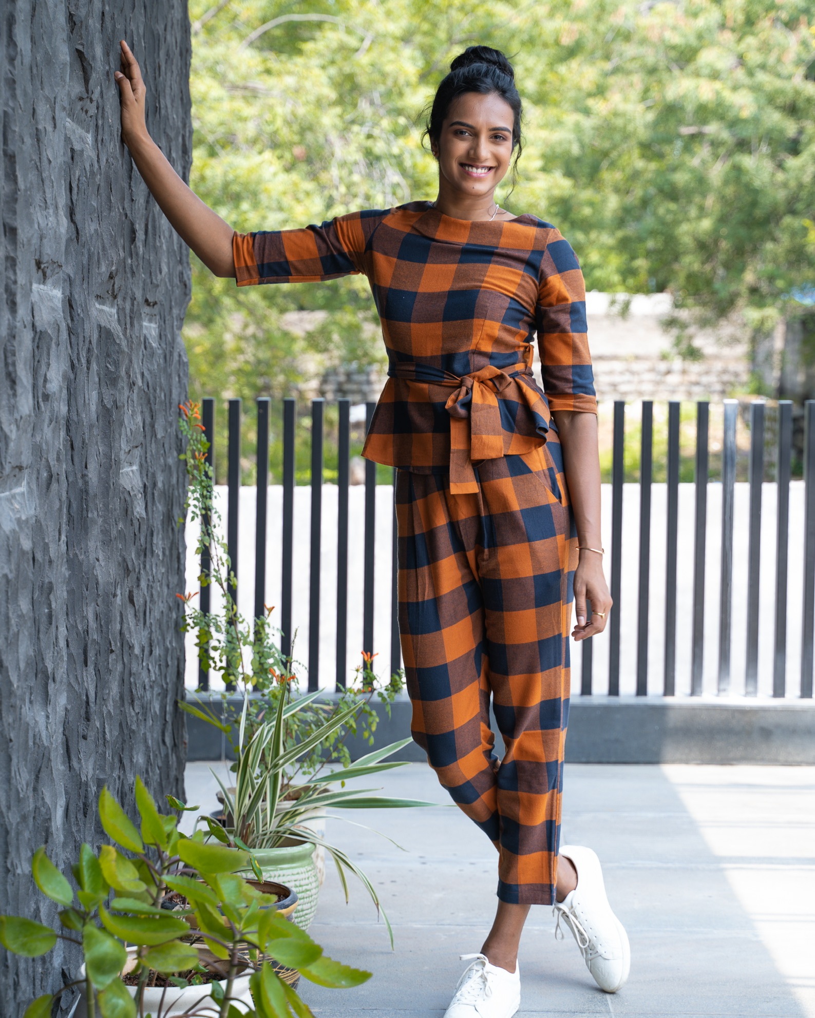 PV Sindhu in checked peplum top and trousers(Bornalii Caldeira)