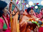 Everyone sings folk songs related to Chhathi Maiya and Surya Bhagwan while waiting for the sun to set. As the sun sets, arghya is offered and the puja is complete for the day. In this pic, devotees perform rituals during Chhath Puja, at New Kidwai Nagar in New Delhi on November 10.(PTI, Vijay Verma)