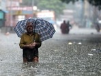 A man holds an umbrella as he wades through a flooded street after heavy monsoon rain in Chennai. (AFP Photo) A man holds an umbrella as he wades through a flooded street after heavy monsoon rain in Chennai. (AFP Photo)