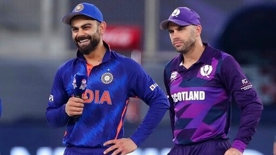 India's captain Virat Kohli, left, smiles as Scotland's captain Kyle Coetzer ahead of the Cricket Twenty20 World Cup match.&nbsp; (AP)