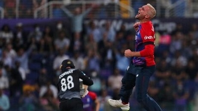 England's Liam Livingstone celebrates the dismissal of New Zealand's Devon Conway during the Cricket Twenty20 World Cup semi-final match between England and New Zealand in Abu Dhabi, UAE, Wednesday, Nov. 10, 2021. (AP Photo/Aijaz Rahi) (AP) England's Liam Livingstone celebrates the dismissal of New Zealand's Devon Conway during the Cricket Twenty20 World Cup semi-final match between England and New Zealand in Abu Dhabi, UAE, Wednesday, Nov. 10, 2021. (AP Photo/Aijaz Rahi) (AP)