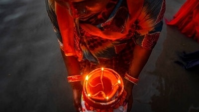 A Hindu woman performs rituals in river Brahmaputra during Chhath Puja festival in Guwahati in Assam on November 10. During Chhath, an ancient Hindu festival, rituals are performed to thank the Sun god for sustaining life on earth.&nbsp; (AP Photo/Anupam Nath)