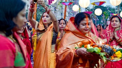 Everyone sings folk songs related to Chhathi Maiya and Surya Bhagwan while waiting for the sun to set. As the sun sets, arghya is offered and the puja is complete for the day. In this pic, devotees perform rituals during Chhath Puja, at New Kidwai Nagar in New Delhi on November 10. (PTI, Vijay Verma)